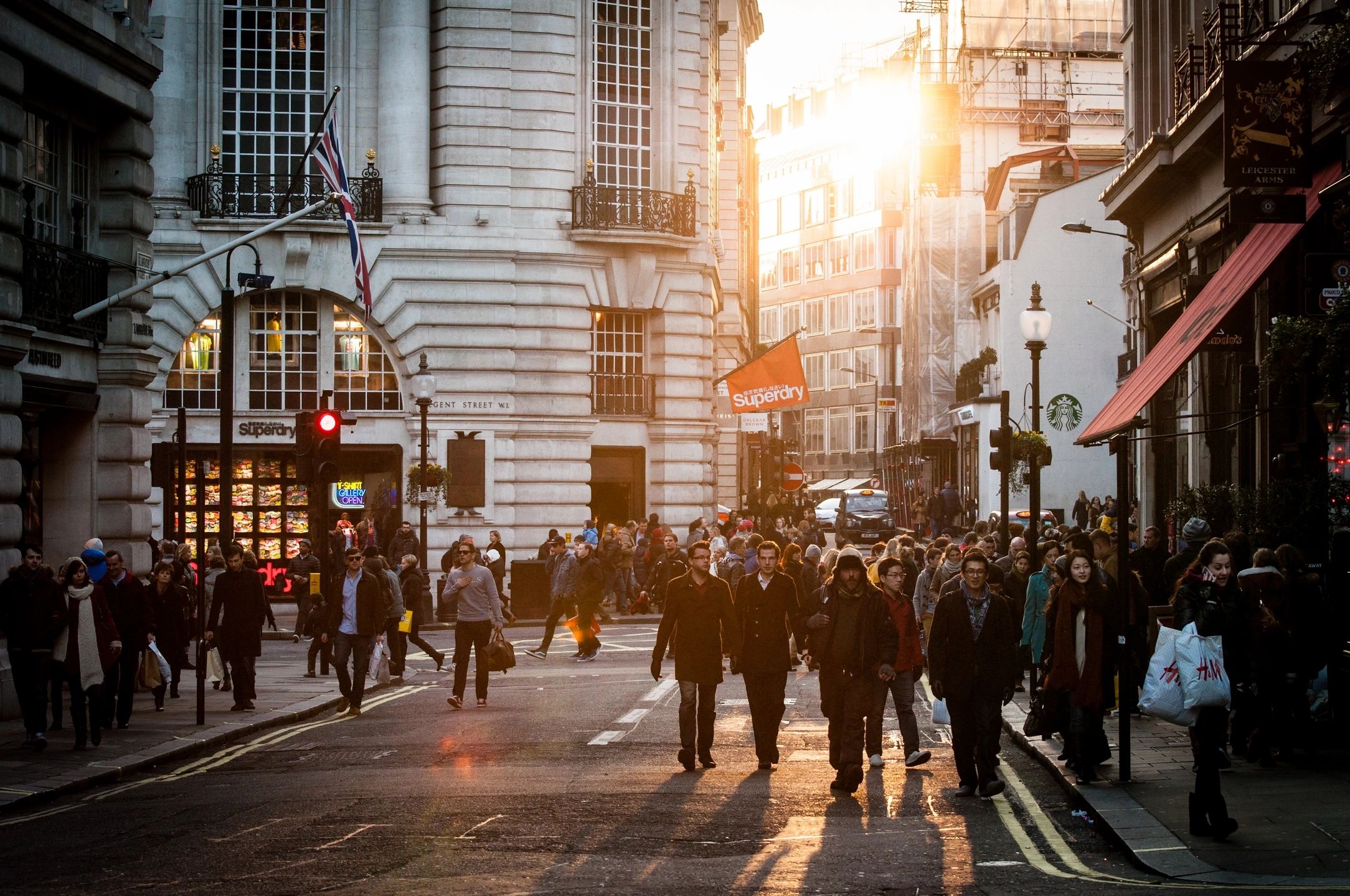 a busy city street at sunrise